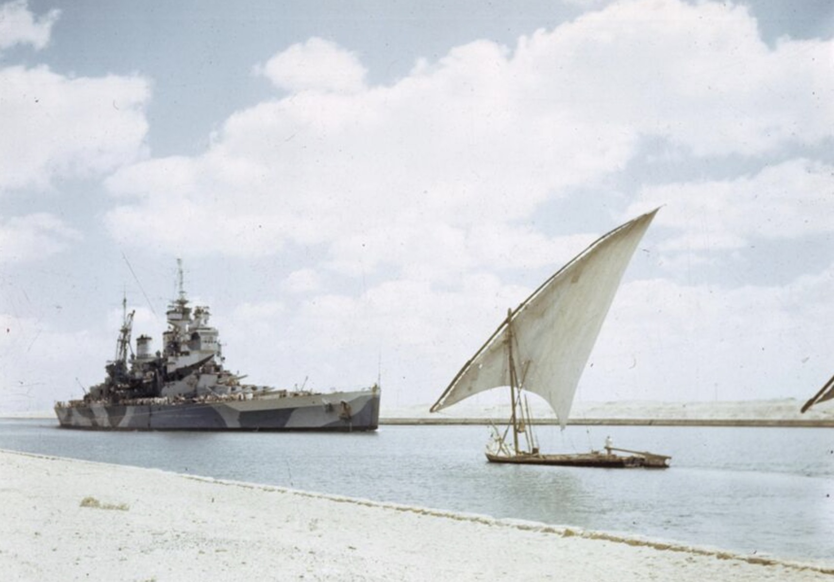 HMS Howe passes through the Suez Canal on her way to join the British Pacific Fleet 